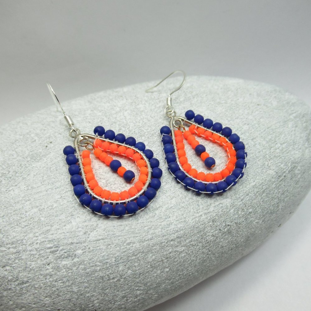 Blue and orange hand stitched earrings